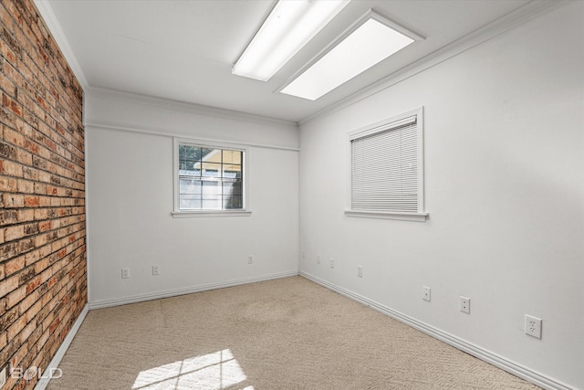 unfurnished room with ornamental molding, brick wall, and light carpet