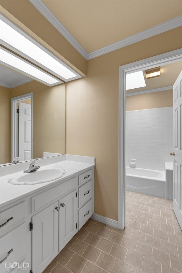 bathroom featuring tile patterned flooring, vanity, a tub to relax in, and ornamental molding