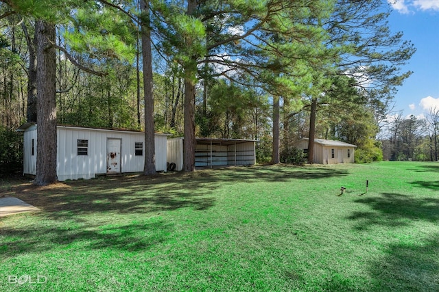 view of yard featuring a carport and a shed