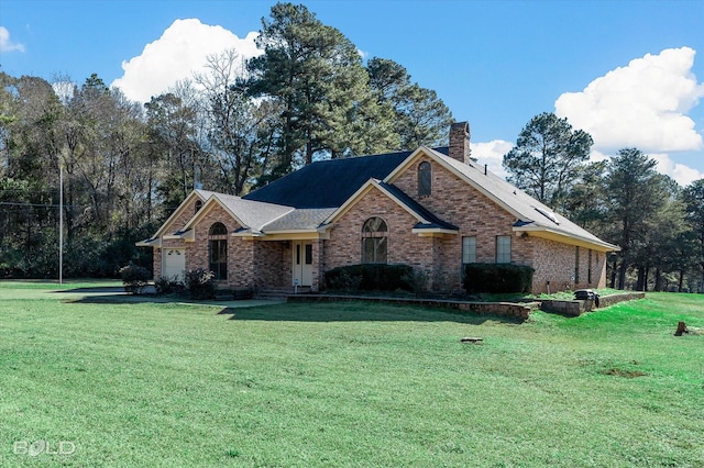 view of front facade featuring a front yard and a garage