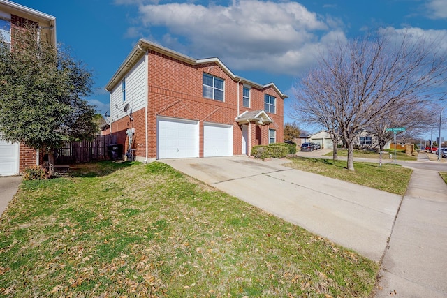 view of front of home with a garage and a front lawn