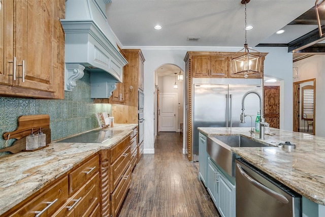 kitchen with black electric stovetop, crown molding, stainless steel dishwasher, tasteful backsplash, and decorative light fixtures