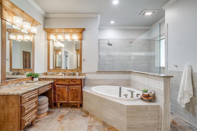 bathroom with vanity, crown molding, and independent shower and bath