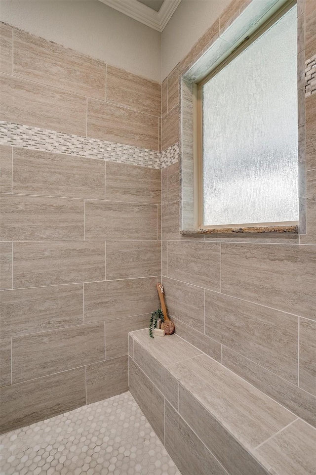 bathroom with tiled shower