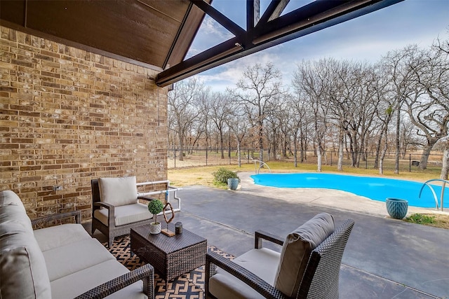 view of pool featuring an outdoor living space and a patio