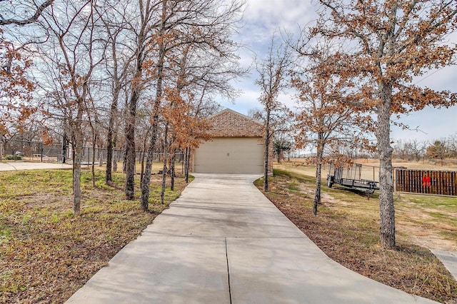 view of front of property with a garage and an outdoor structure