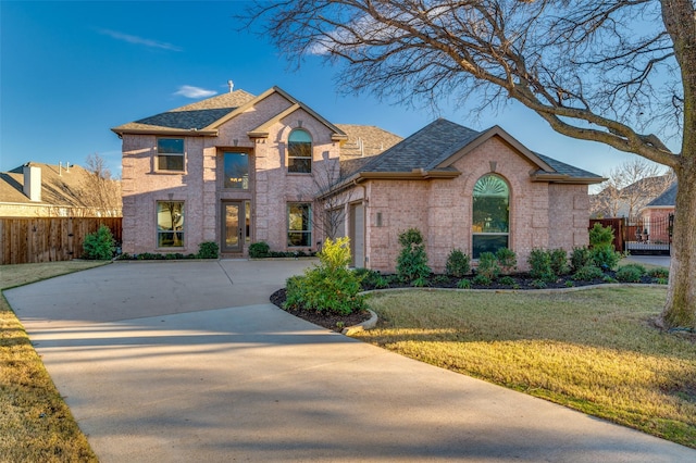 french provincial home featuring a front lawn