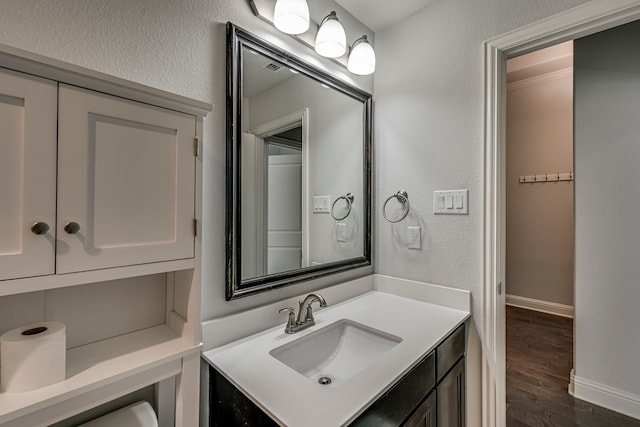 bathroom with vanity and wood-type flooring