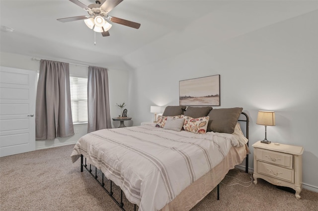 carpeted bedroom with ceiling fan and lofted ceiling