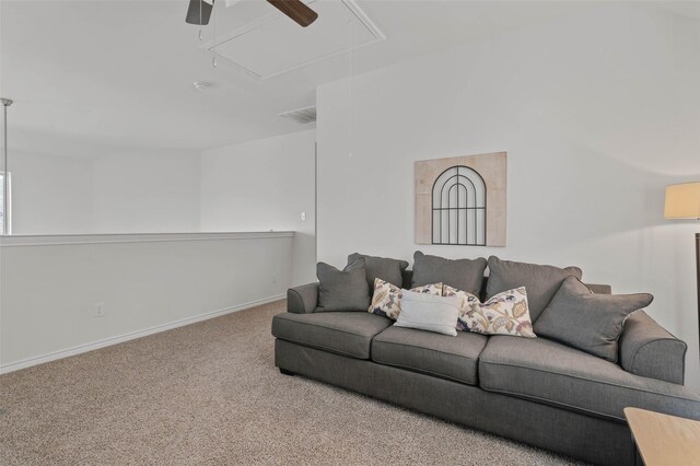 carpeted living room with ceiling fan