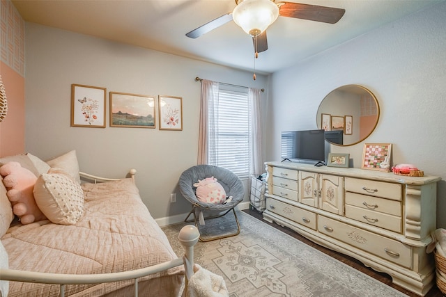 sitting room featuring ceiling fan