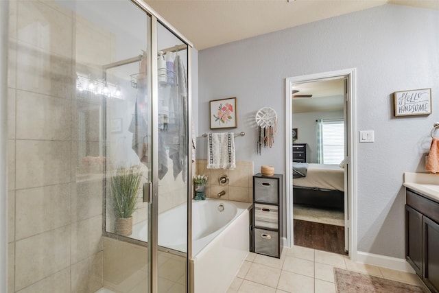 bathroom featuring tile patterned flooring, vanity, and independent shower and bath