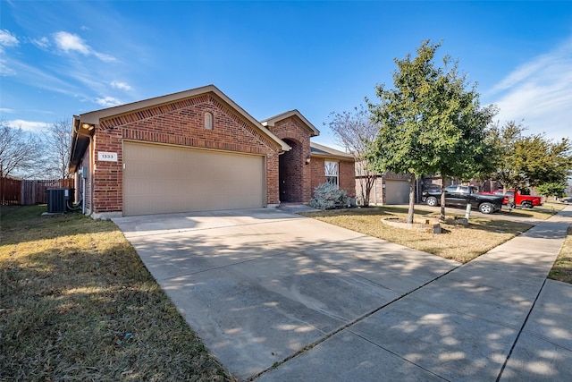 ranch-style home featuring central AC, a front lawn, and a garage