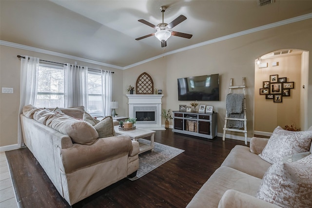 living room featuring crown molding, ceiling fan, and dark hardwood / wood-style floors