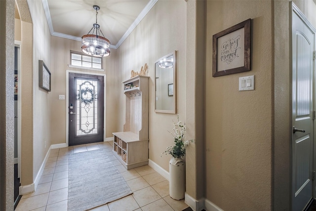 tiled foyer featuring an inviting chandelier and crown molding