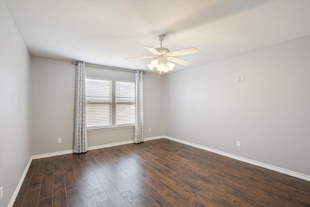 spare room featuring ceiling fan and dark hardwood / wood-style flooring