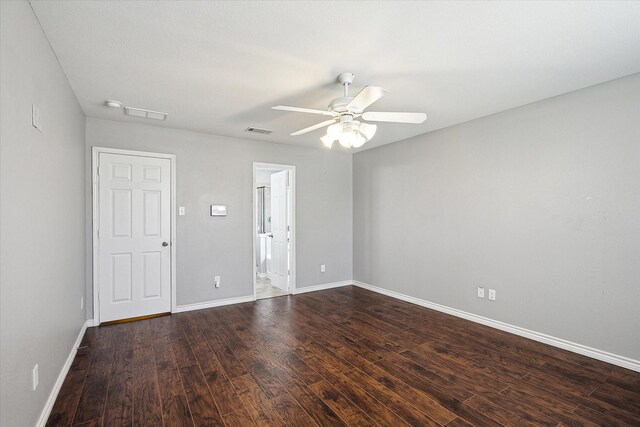 unfurnished room with dark hardwood / wood-style floors and ceiling fan