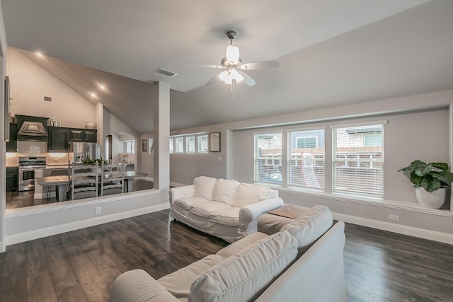 living room featuring ceiling fan, dark wood-type flooring, and lofted ceiling