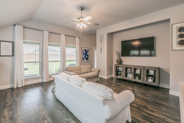 living room featuring ceiling fan, dark wood-type flooring, and vaulted ceiling