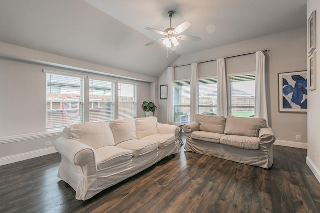 living room featuring plenty of natural light, ceiling fan, dark wood-type flooring, and vaulted ceiling