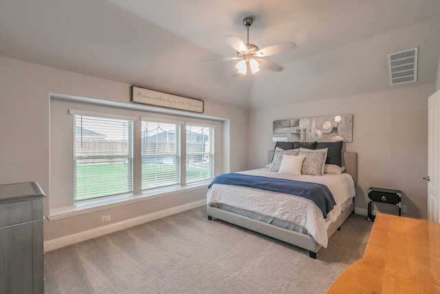 bedroom with carpet flooring, vaulted ceiling, and ceiling fan