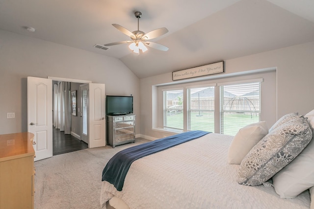 carpeted bedroom with ceiling fan and lofted ceiling