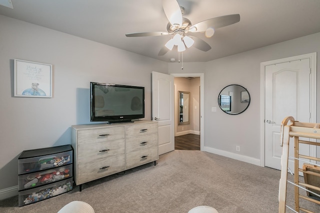 carpeted bedroom with ceiling fan