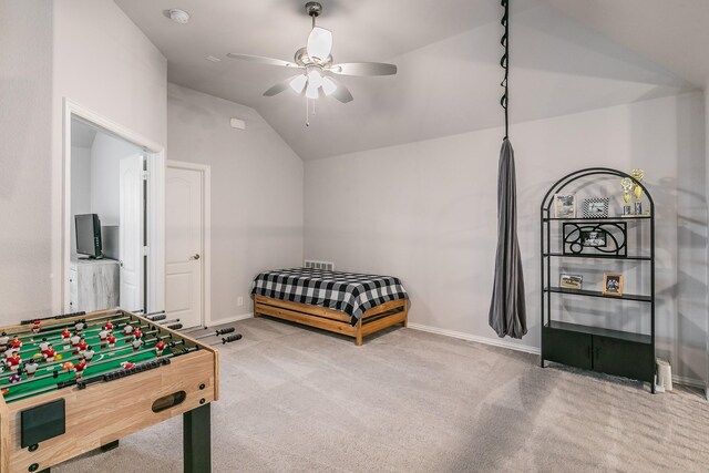 bedroom with carpet flooring, ceiling fan, and lofted ceiling