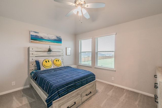 bedroom with carpet floors, vaulted ceiling, and ceiling fan