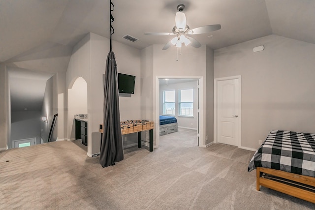 carpeted bedroom with ceiling fan and lofted ceiling