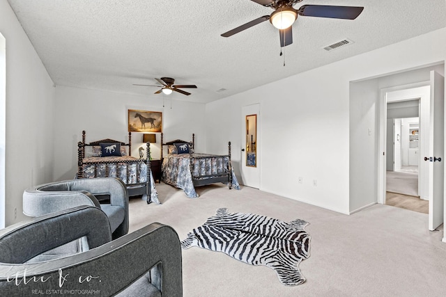 bedroom with light carpet, a textured ceiling, and ceiling fan