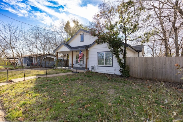 view of front of house with a front lawn and covered porch