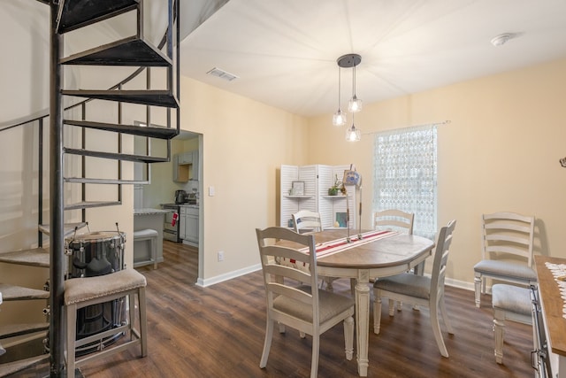 dining room with dark hardwood / wood-style flooring