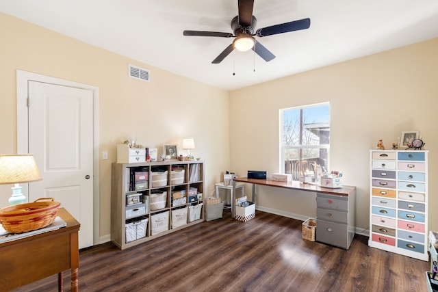 home office with dark wood-type flooring and ceiling fan