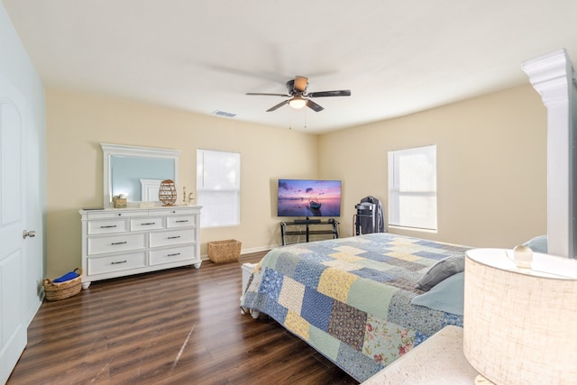 bedroom featuring dark hardwood / wood-style floors and ceiling fan