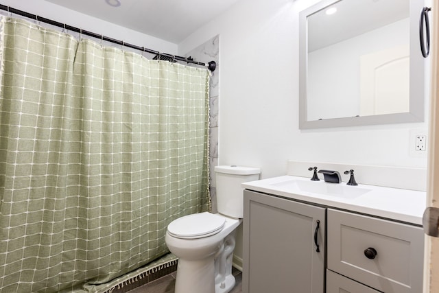 bathroom featuring vanity, a shower with curtain, and toilet