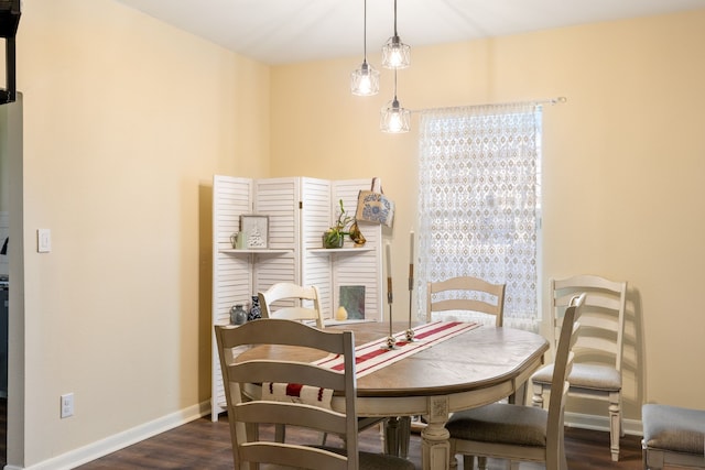 dining room with dark wood-type flooring