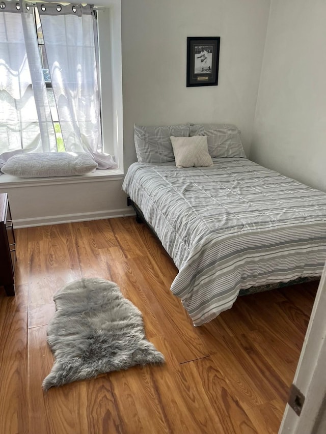 bedroom featuring hardwood / wood-style floors