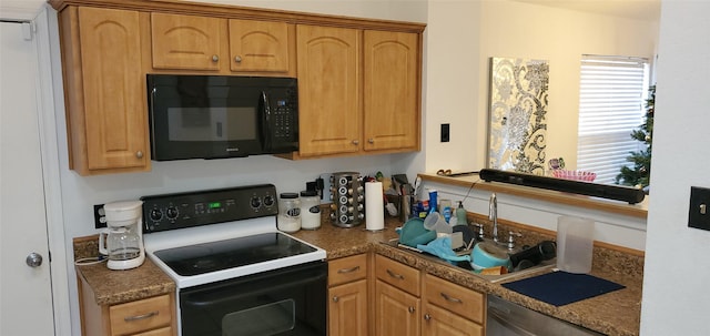 kitchen featuring dishwasher, sink, stone counters, and electric stove