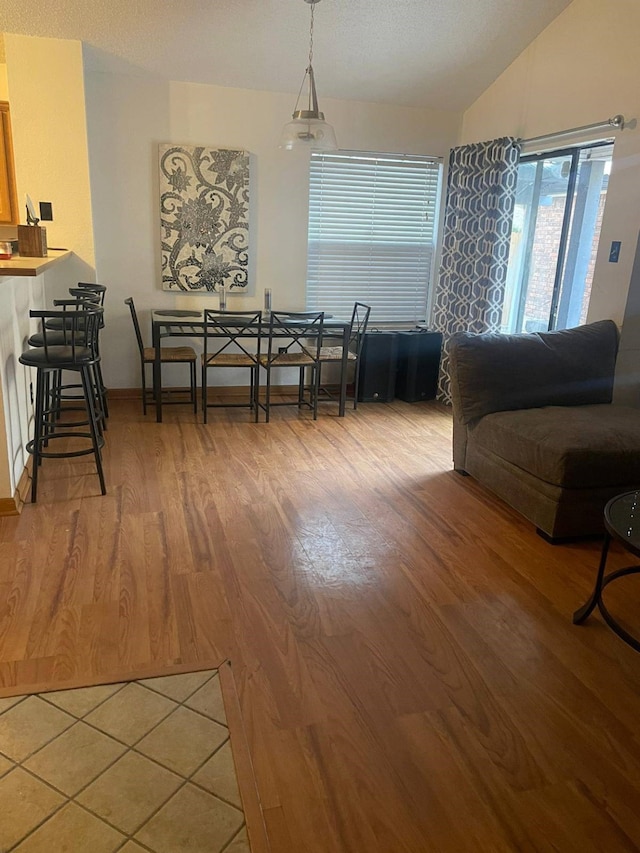 interior space with hardwood / wood-style flooring and vaulted ceiling