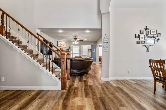 foyer featuring ceiling fan and wood-type flooring