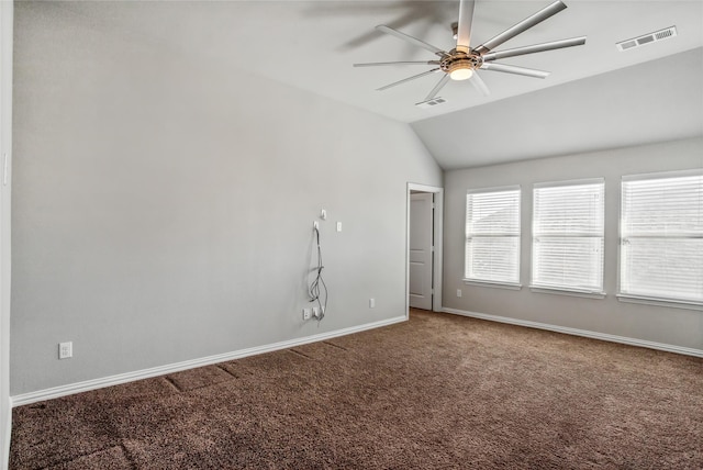 unfurnished room featuring ceiling fan, vaulted ceiling, and carpet