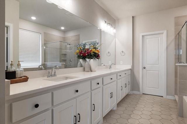 bathroom with vanity and a shower with shower door