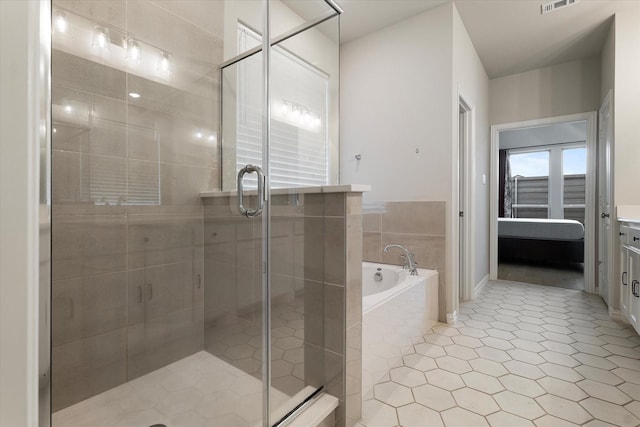 bathroom with tile patterned floors and plus walk in shower