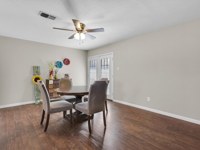 bathroom with hardwood / wood-style floors, vanity, toilet, and a shower with door