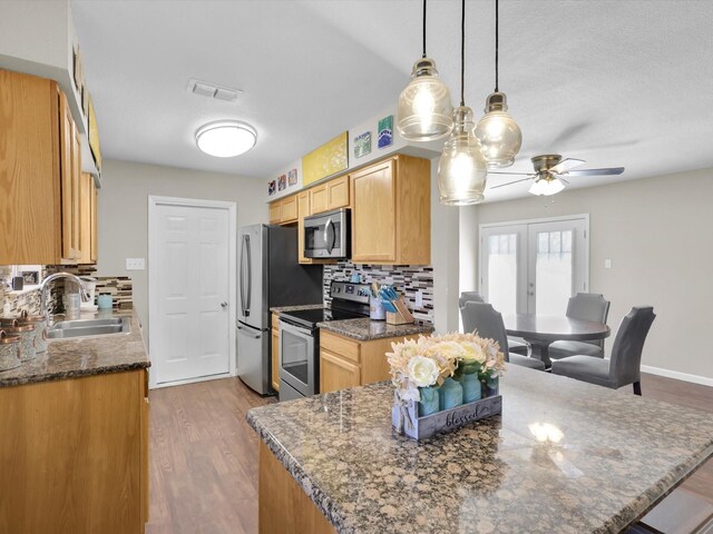 living room with hardwood / wood-style flooring and ceiling fan