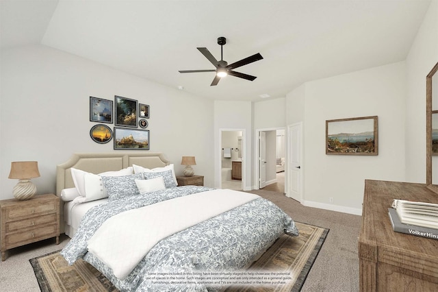 bedroom with ensuite bathroom, baseboards, vaulted ceiling, ceiling fan, and carpet floors