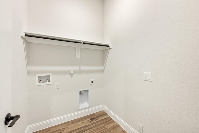 laundry area featuring wood finished floors, hookup for a washing machine, hookup for an electric dryer, hookup for a gas dryer, and laundry area