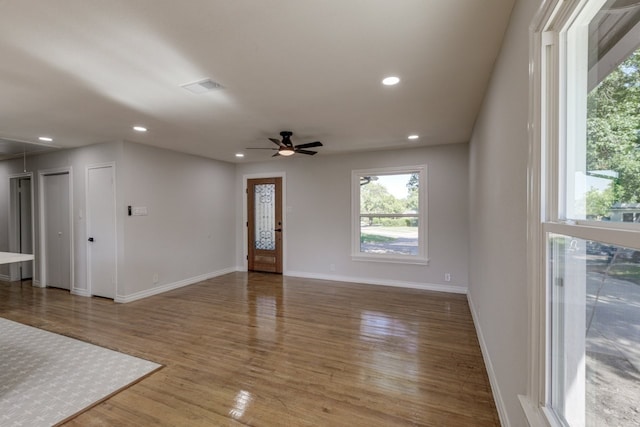 empty room featuring ceiling fan and hardwood / wood-style floors