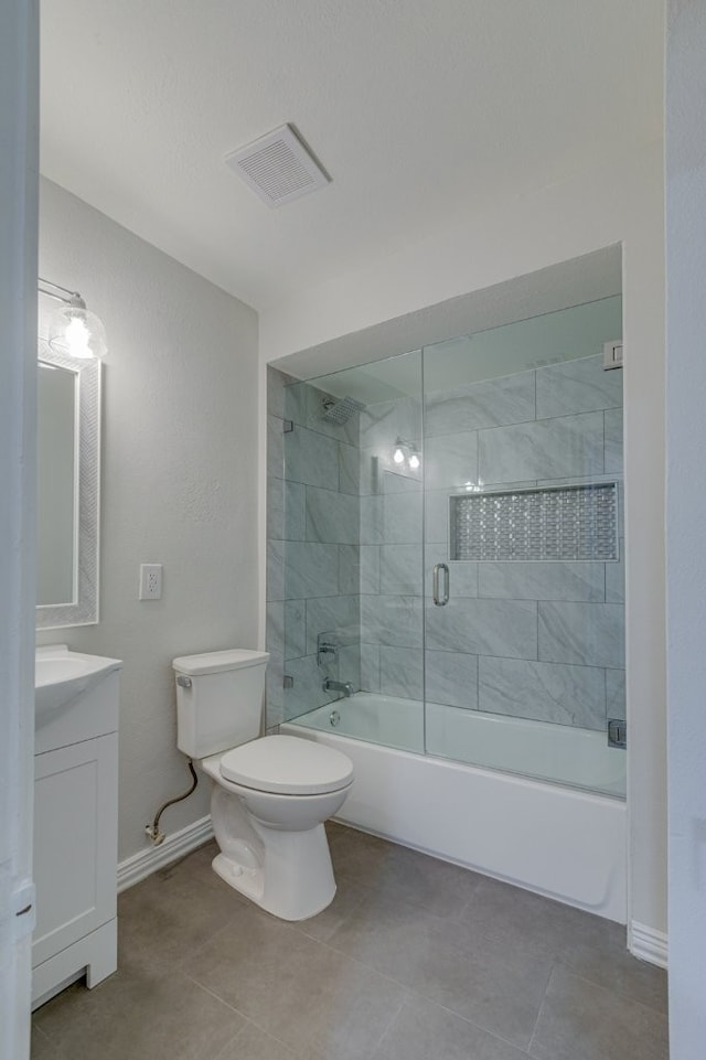 full bathroom with vanity, enclosed tub / shower combo, and toilet